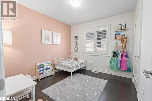 Bedroom with dark hardwood / wood-style floors - 19 Mugford Crescent, Brampton, ON - Indoor