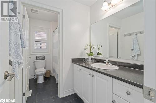 Bathroom featuring toilet, vanity, and tile patterned floors - 19 Mugford Crescent, Brampton, ON - Indoor Photo Showing Bathroom