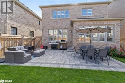 Back of house featuring outdoor lounge area and a patio area - 