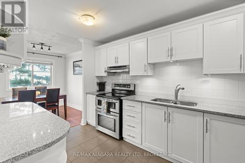 142 - 1058 Falgarwood Drive, Oakville (Iroquois Ridge South), ON - Indoor Photo Showing Kitchen With Double Sink