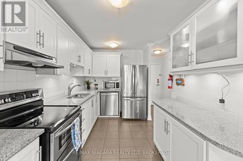 142 - 1058 Falgarwood Drive, Oakville (Iroquois Ridge South), ON - Indoor Photo Showing Kitchen With Stainless Steel Kitchen With Double Sink