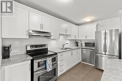 142 - 1058 Falgarwood Drive, Oakville (Iroquois Ridge South), ON - Indoor Photo Showing Kitchen With Stainless Steel Kitchen With Double Sink