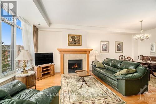 407 - 136 Darlington, Ottawa, ON - Indoor Photo Showing Living Room With Fireplace