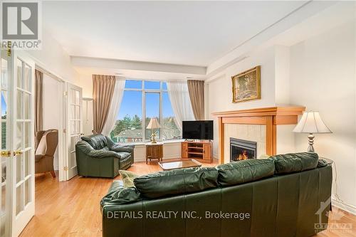 407 - 136 Darlington, Ottawa, ON - Indoor Photo Showing Living Room With Fireplace