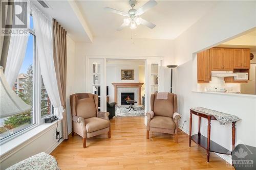 407 - 136 Darlington, Hunt Club - Windsor Park Village And Area (4803 - Hunt Club/Western Community), ON - Indoor Photo Showing Living Room With Fireplace