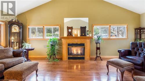 Living room featuring hardwood / wood-style flooring, plenty of natural light, and high vaulted ceiling - 490 7Th Street W, Owen Sound, ON - Indoor Photo Showing Living Room With Fireplace