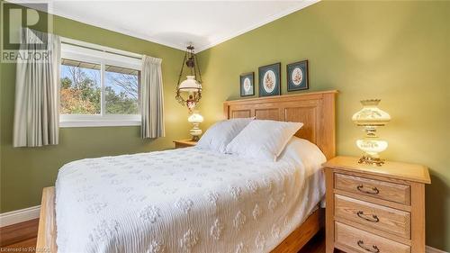 Bedroom featuring hardwood / wood-style flooring and crown molding - 490 7Th Street W, Owen Sound, ON - Indoor Photo Showing Bedroom