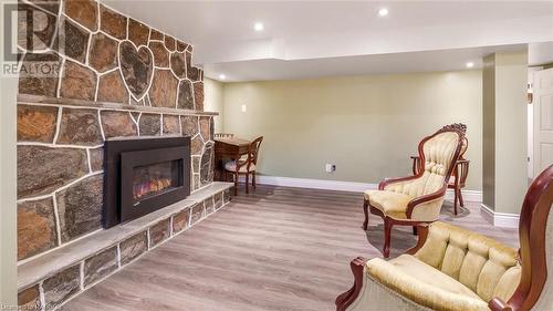 Living area with a fireplace and wood-type flooring - 490 7Th Street W, Owen Sound, ON - Indoor With Fireplace