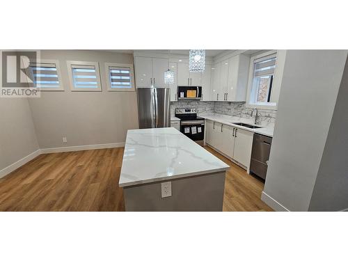 125 Calgary Avenue Unit# 105, Penticton, BC - Indoor Photo Showing Kitchen With Double Sink