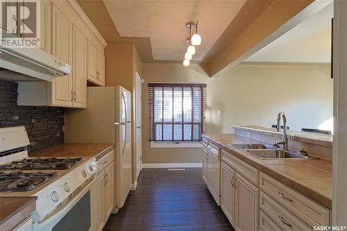 2215 5Th Avenue W, Prince Albert, SK - Indoor Photo Showing Kitchen With Double Sink