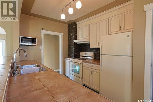 2215 5Th Avenue W, Prince Albert, SK - Indoor Photo Showing Kitchen With Double Sink