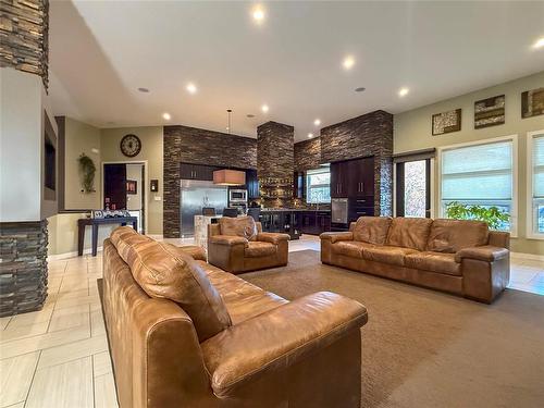 7 Wren Crescent, Brandon, MB - Indoor Photo Showing Living Room With Fireplace