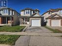 View of front of house featuring a garage, a front yard, and a porch - 973 Atlantic Boulevard, Waterloo, ON  - Outdoor With Facade 