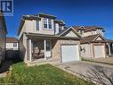 View of front facade featuring a garage and a porch - 973 Atlantic Boulevard, Waterloo, ON  - Outdoor With Facade 