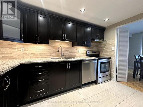 611 - 11 Wincott Drive, Toronto, ON - Indoor Photo Showing Kitchen With Stainless Steel Kitchen With Double Sink With Upgraded Kitchen