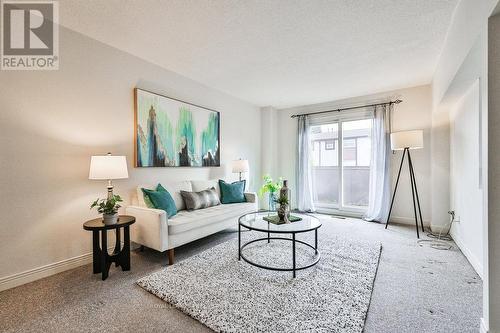 99 - 1221 Dundix Road, Mississauga, ON - Indoor Photo Showing Living Room