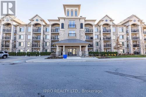 304 - 1450 Main Street E, Milton, ON - Outdoor With Balcony With Facade