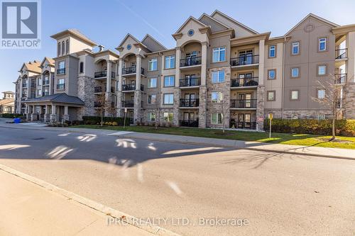 304 - 1450 Main Street E, Milton, ON - Outdoor With Balcony With Facade