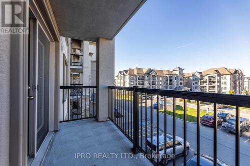 304 - 1450 Main Street E, Milton, ON - Outdoor With Balcony With Exterior