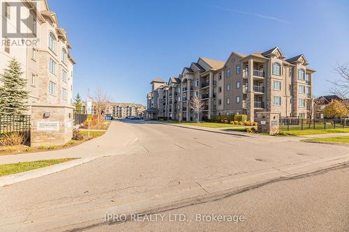 304 - 1450 Main Street E, Milton, ON - Outdoor With Balcony With Facade