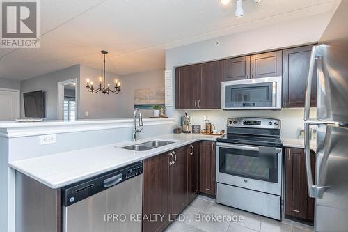 304 - 1450 Main Street E, Milton, ON - Indoor Photo Showing Kitchen With Stainless Steel Kitchen With Double Sink