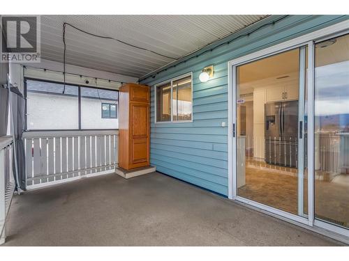 Back Deck, Covered with BBQ Gas Hookup and Stairs going down to Backyard. - 1730 Simpson Court, Kelowna, BC - Outdoor With Exterior