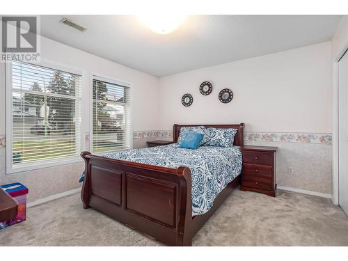 Bottom Floor Bed #4 - 1730 Simpson Court, Kelowna, BC - Indoor Photo Showing Bedroom