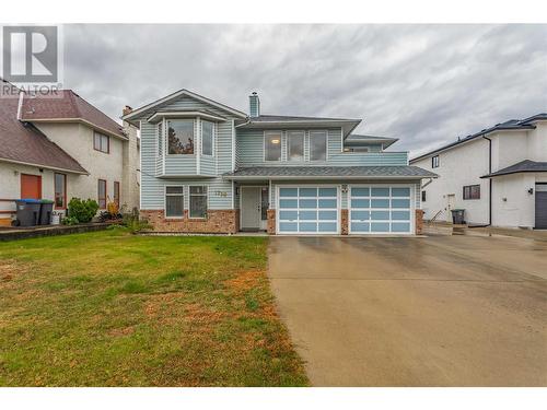 Double Garage with Ample Parking! - 1730 Simpson Court, Kelowna, BC - Outdoor With Facade