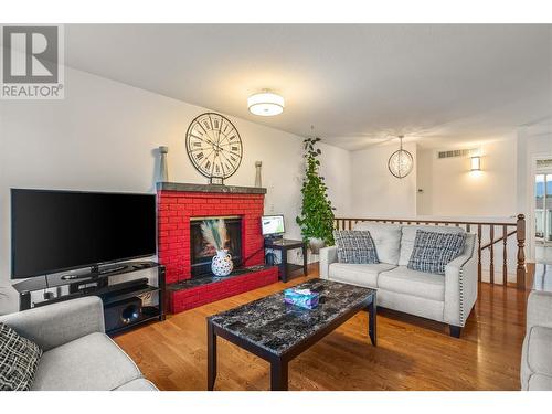 Main Living Room with Gas Fireplace - 1730 Simpson Court, Kelowna, BC - Indoor Photo Showing Living Room With Fireplace