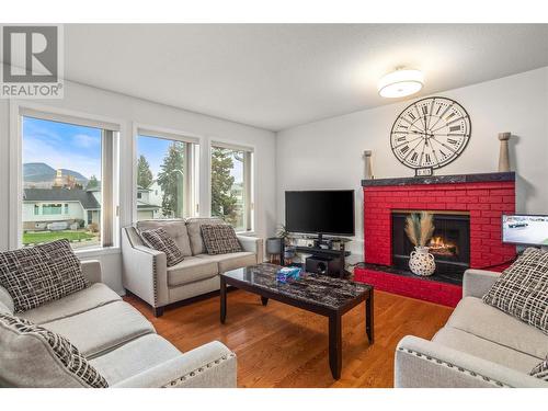 Living Room with Gas Fireplace - 1730 Simpson Court, Kelowna, BC - Indoor Photo Showing Living Room With Fireplace