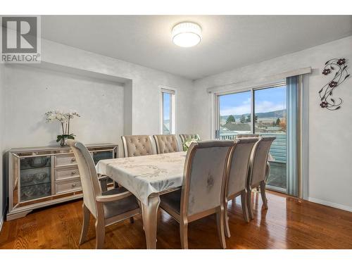 Dining Room leading to Outdoor Deck - 1730 Simpson Court, Kelowna, BC - Indoor Photo Showing Dining Room