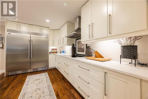 cooktop and hoodfan - 68 Beaver Creek Trail, Pembroke, ON - Indoor Photo Showing Kitchen