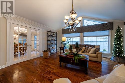 oversized windows for the view and French doors. - 68 Beaver Creek Trail, Pembroke, ON - Indoor Photo Showing Living Room