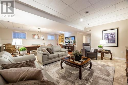 family room with wet bar - 68 Beaver Creek Trail, Pembroke, ON - Indoor Photo Showing Living Room