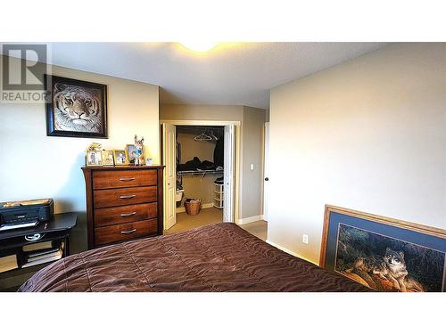 1990 Pacific Way Unit# 30, Kamloops, BC - Indoor Photo Showing Bedroom With Fireplace