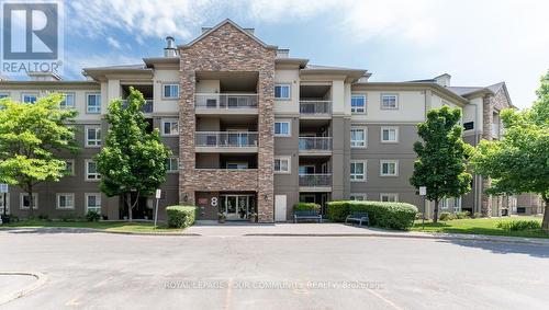 410 - 8 Dayspring Circle, Brampton, ON - Outdoor With Balcony With Facade