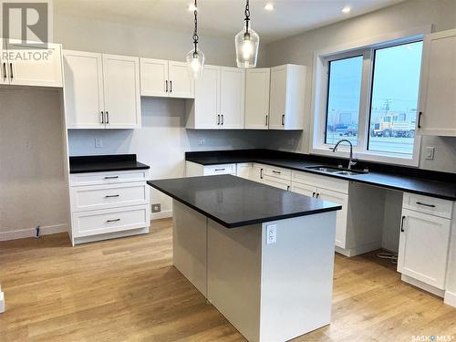 10 Aspen Place, Humboldt, SK - Indoor Photo Showing Kitchen With Double Sink