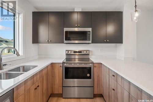 666 Mcormond Drive, Saskatoon, SK - Indoor Photo Showing Kitchen With Double Sink