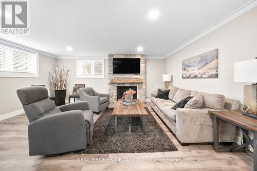 8 Crystalwood Lane, Springwater, ON - Indoor Photo Showing Living Room With Fireplace