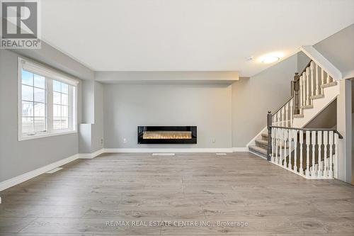 100 - 620 Ferguson Drive, Milton, ON - Indoor With Fireplace