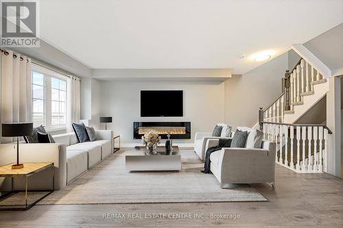 100 - 620 Ferguson Drive, Milton, ON - Indoor Photo Showing Living Room