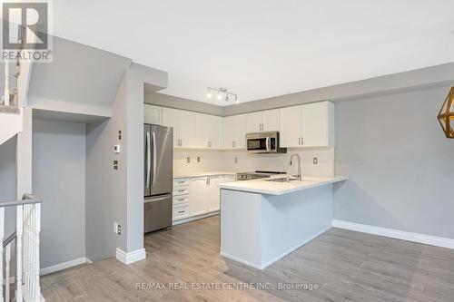 100 - 620 Ferguson Drive, Milton, ON - Indoor Photo Showing Kitchen