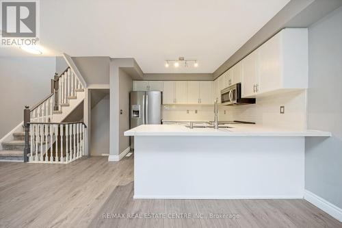 100 - 620 Ferguson Drive, Milton, ON - Indoor Photo Showing Kitchen With Double Sink