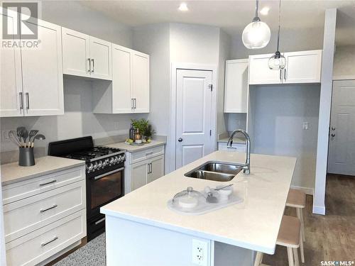 8 Aspen Place, Humboldt, SK - Indoor Photo Showing Kitchen With Double Sink With Upgraded Kitchen