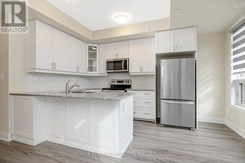 108 - 1569 Rose Way, Milton, ON - Indoor Photo Showing Kitchen With Stainless Steel Kitchen With Upgraded Kitchen