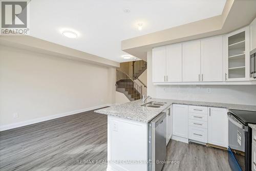 108 - 1569 Rose Way, Milton, ON - Indoor Photo Showing Kitchen With Double Sink