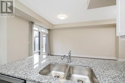 108 - 1569 Rose Way, Milton, ON - Indoor Photo Showing Kitchen With Double Sink