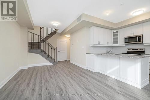 108 - 1569 Rose Way, Milton, ON - Indoor Photo Showing Kitchen