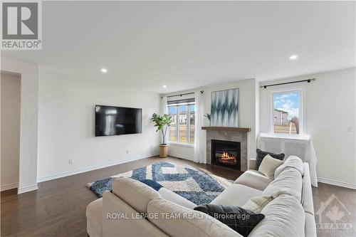 19 Tolchaco Court, Ottawa, ON - Indoor Photo Showing Living Room With Fireplace