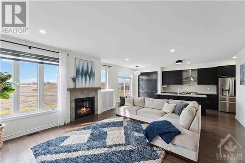 19 Tolchaco Court, Ottawa, ON - Indoor Photo Showing Living Room With Fireplace